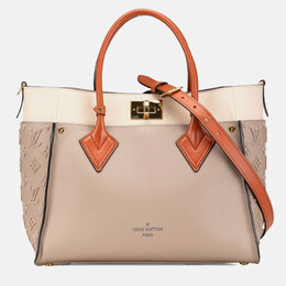 Louis Vuitton: Серая сумка на руку 