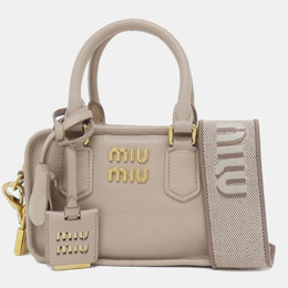 Miu Miu: Бежевая сумка 
