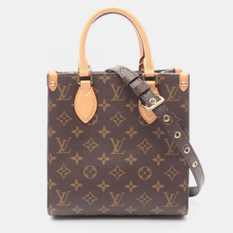 Louis Vuitton: Коричневая сумка 