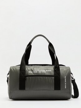 Calvin Klein Jeans: Тёмная дорожная сумка 